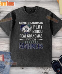 Playful grandmas in Seattle Mariners shirts enjoying baseball, showcasing 'Real Grandmas Watch Mariners' t-shirt design.