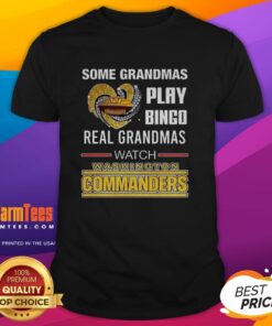 Grandma wearing a 'Real Grandmas Watch Washington Commanders Football' T-shirt while enjoying a game day with friends.