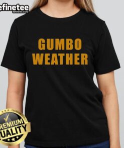 Alt Text: Woman wearing Nice T Bob Hebert Gumbo Weather Ladies Tee, showcasing a stylish design perfect for casual outings.