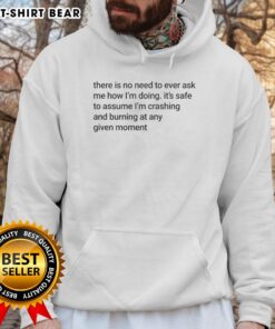 Funny meme hoodie featuring the phrase 'No need to ask how I'm doing, I'm crashing and burning' for humor lovers.