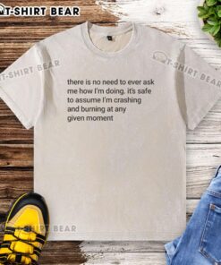 Alt Text: Funny meme on a washed t-shirt: 'No need to ask how I'm doing, I'm crashing and burning.' Perfect for casual wear.