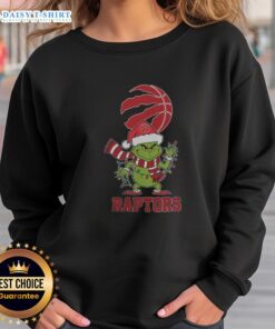 Toronto Raptors Christmas Grinch Santa Hat sweatshirt for the 2025 holiday season, perfect for fans and festive cheer.