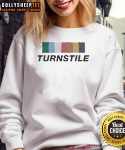 Colorful Nice Turnstile sweatshirt with vibrant wall art, showcasing trendy streetwear style.