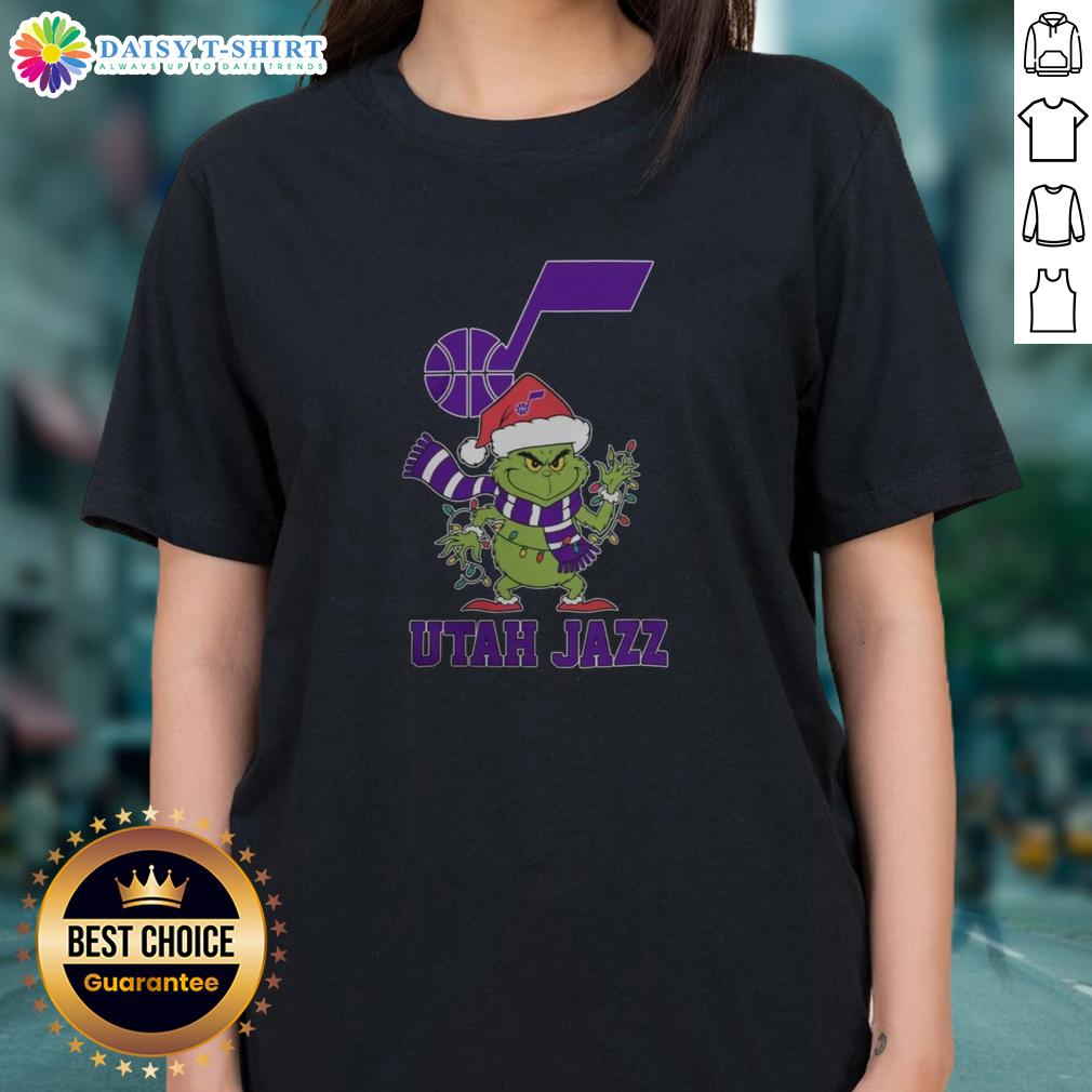 Nice Utah Jazz Christmas Grinch Santa Hat Holiday 2025 Ladies Tee Utah Jazz Christmas tee for ladies featuring Grinch and Santa hat design, perfect for holiday 2025 celebrations.