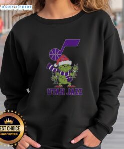 Nice Utah Jazz Christmas Grinch Santa Hat Holiday 2025 Sweatshirt design featuring festive colors and team logo.