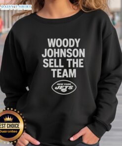Nice Woody Johnson selling the New York Jets sweatshirt at a fan event, showcasing team spirit and merchandise.