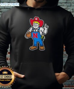 Alt Text: Andrew Whitworth and Ryan Fitzpatrick in Nebraska Huskers Herbie mascot hoodie, showcasing team spirit and camaraderie.