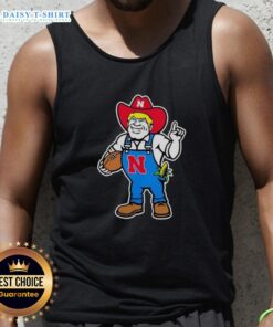 Andrew Whitworth and Ryan Fitzpatrick in Nebraska Huskers Herbie mascot tank top, showcasing team spirit and camaraderie.
