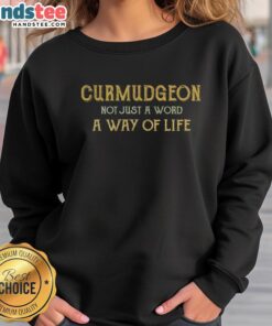 Alt Text: Cozy Official Curmudgeon sweatshirt showcasing the phrase Not Just A Word, A Way Of Life in stylish lettering.