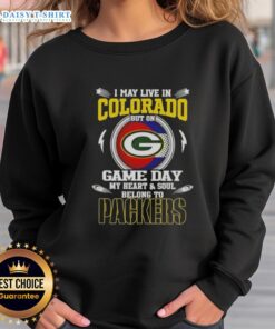 Alt Text: Cozy green sweatshirt with I May Live In Colorado But On Game Day My Heart Belongs To Green Bay Packers text.