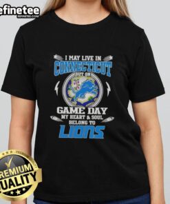 Alt Text: Ladies tee featuring 'I May Live In Connecticut But On Game Day My Heart And Soul Belongs To Detroit Lions' design.