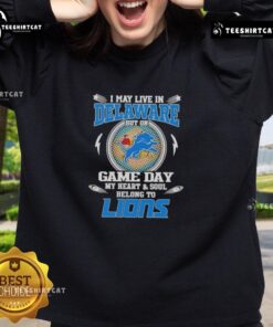 Official I May Live In Delaware But On Game Day My Heart And Soul Belongs To Detroit Lions Sweatshirt in blue and gold.