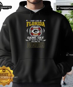 Alt Text: Green Bay Packers hoodie with 'I May Live In Florida, But On Game Day My Heart And Soul Belongs To Green Bay' design.