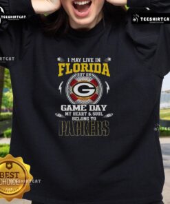 Green Bay Packers sweatshirt with 'I May Live In Florida, But On Game Day My Heart Belongs To Green Bay' design.