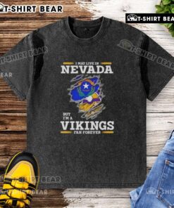 Official I May Live In Nevada But I'm A Minnesota Vikings Fan Forever washed t-shirt showcasing team pride.