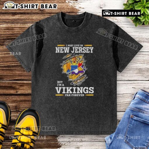 Official I May Live In New Jersey But I'm A Minnesota Vikings Fan Forever washed t-shirt design featuring team colors.