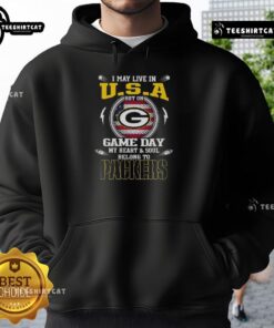 Green Bay Packers hoodie with the slogan I May Live In U.S.A But On Game Day My Heart And Soul Belongs To showcased.