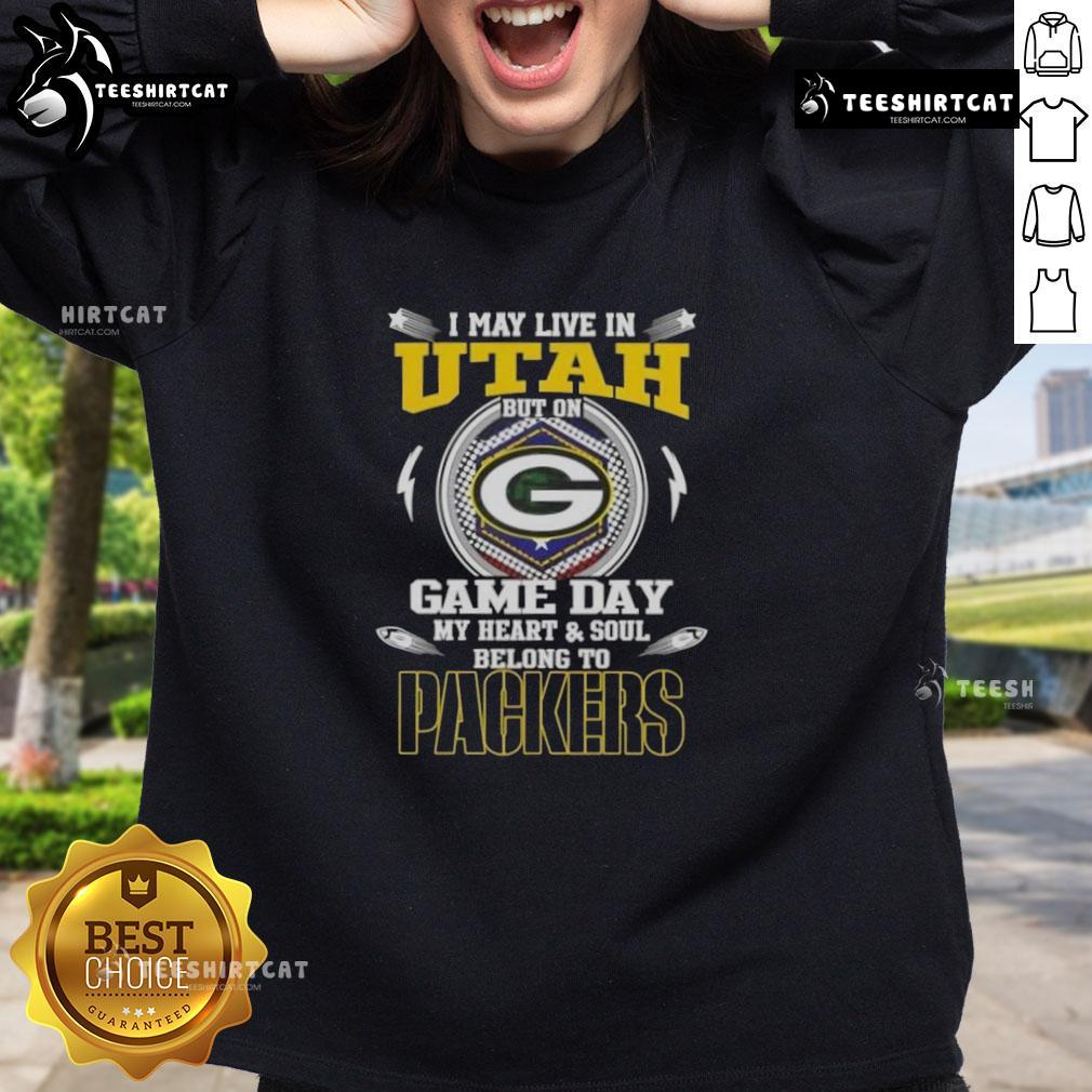 Official I May Live In Utah But On Game Day My Heart And Soul Belongs To Green Bay Packers Sweatshirt Alt Text: Green Bay Packers sweatshirt with I may live in Utah but on game day my heart and soul belongs to Green Bay design.