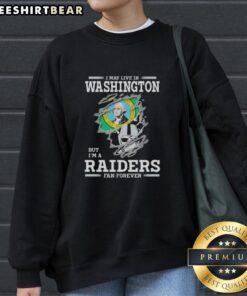 Official 'I May Live In Washington But I'm A Raiders Fan Forever' sweatshirt showcasing team spirit and style.