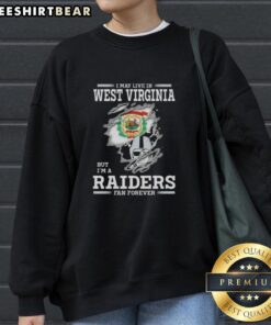 Cozy sweatshirt featuring 'I May Live In West Virginia But I'm A Raiders Fan Forever' design, perfect for Raiders fans.