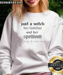 Official Just A Witch sweatshirt featuring a witch, her familiar, and a spellbook, perfect for magical vibes.