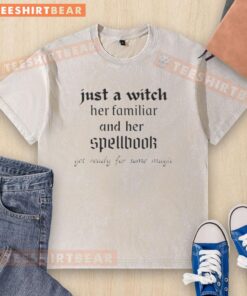 Official Just A Witch washed t-shirt featuring a witch, her familiar, and a spellbookperfect for magic lovers!