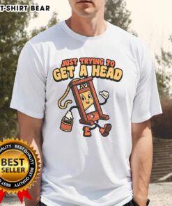 Alt Text: Official Just Trying To Get A Head Guillotine T-Shirt featuring a unique graphic design and bold typography.