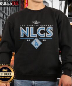 Alt Text: Official Los Angeles Dodgers 2025 NLCS Division Series Winner Postseason Sweatshirt in blue with team logo.