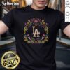 Alt Text: Official Los Angeles Dodgers Da De Los Muertos MLB celebration t-shirt featuring vibrant designs and team logo.