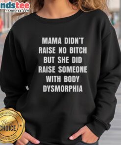 Alt Text: Cozy sweatshirt featuring Mama Didn't Raise No Bitch design, addressing body dysmorphia with a bold statement.