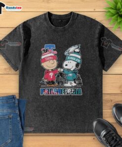 Official Philadelphia Phillies and Eagles 75th Anniversary Peanuts Snoopy washed t-shirt featuring a vintage design.