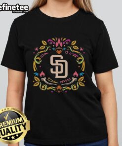Official San Diego Padres Dia de los Muertos MLB celebration ladies tee featuring vibrant design and team logo.