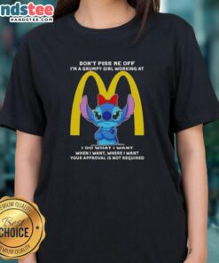 Grumpy girl wearing Official Stitch t-shirt at McDonald's, showcasing playful attitude with 'Don't Piss Me Off' slogan.