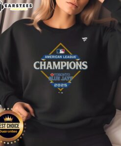 Alt Text: Official Toronto Blue Jays 2025 MLB American League Champions locker room sweatshirt displayed on a hanger.