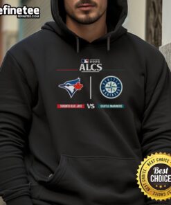 Official Toronto Blue Jays vs Seattle Mariners 2025 ALCS Matchup MLB Postseason Game Day Hoodie featuring team logos.