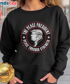 Official Trump The Peace President sweatshirt featuring 'Peace Through Strength' slogan, perfect for supporters and fans.