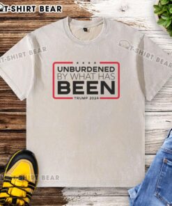 Official Unburdened By What Has Been Trump 2024 washed t-shirt featuring a stylish design for election supporters.