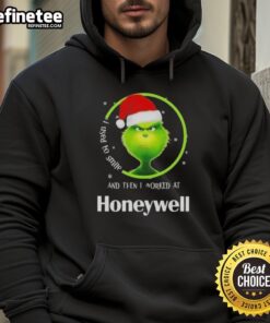 Funny Grinch Christmas hoodie featuring 'I Used to Smile and Then I Worked at Honeywell' design for festive humor.