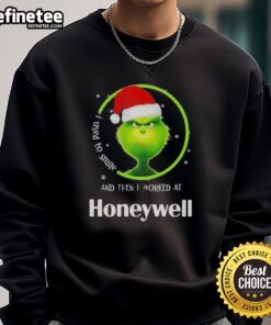 Funny Grinch Christmas sweatshirt featuring I Used to Smile and Then I Worked at Honeywell text in festive design.