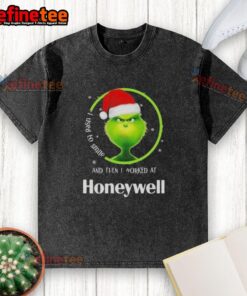 Funny Grinch Christmas t-shirt featuring the phrase I Used To Smile And Then I Worked At Honeywell on a vibrant background.