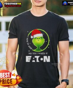 Alt Text: Original Grinch Christmas t-shirt featuring 'I Used To Smile And Then I Worked At Eaton Corporation' design.
