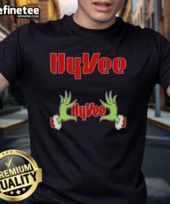 Alt Text: Original Grinch Hands Love Hyvee Christmas T-Shirt featuring festive design perfect for holiday celebrations.