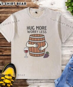 Original Hug Wine Barrel 'More Worry Less' washed t-shirt displayed on a wooden background, perfect for wine lovers.