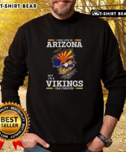 Cozy sweatshirt featuring 'I May Live In Arizona But I'm A Minnesota Vikings Fan Forever' design, perfect for loyal fans.