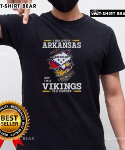Original I May Live In Arkansas But Im A Minnesota Vikings Fan Forever T-Shirt featuring bold team colors and logo design.