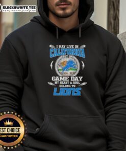 Original hoodie saying 'I may live in California, but my heart belongs to Detroit Lions' perfect for game day.