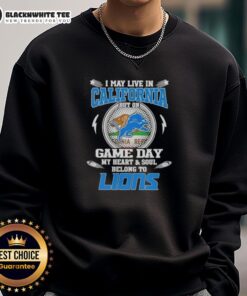 Alt Text: Cozy 'I May Live in California But On Game Day My Heart Belongs to Detroit Lions' sweatshirt perfect for fans.