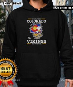 Cozy hoodie featuring 'I May Live In Colorado But I'm A Minnesota Vikings Fan Forever' design, perfect for Vikings fans.