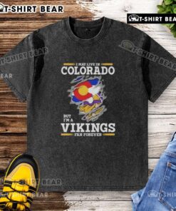 Original 'I May Live in Colorado But I'm a Minnesota Vikings Fan Forever' washed t-shirt on display.