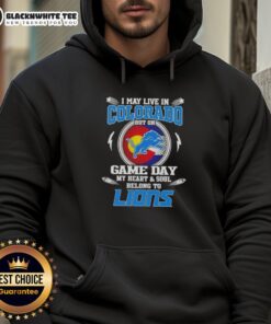 Alt Text: Detroit Lions hoodie with 'I May Live In Colorado But My Heart Belongs To Detroit' slogan, perfect for game day.